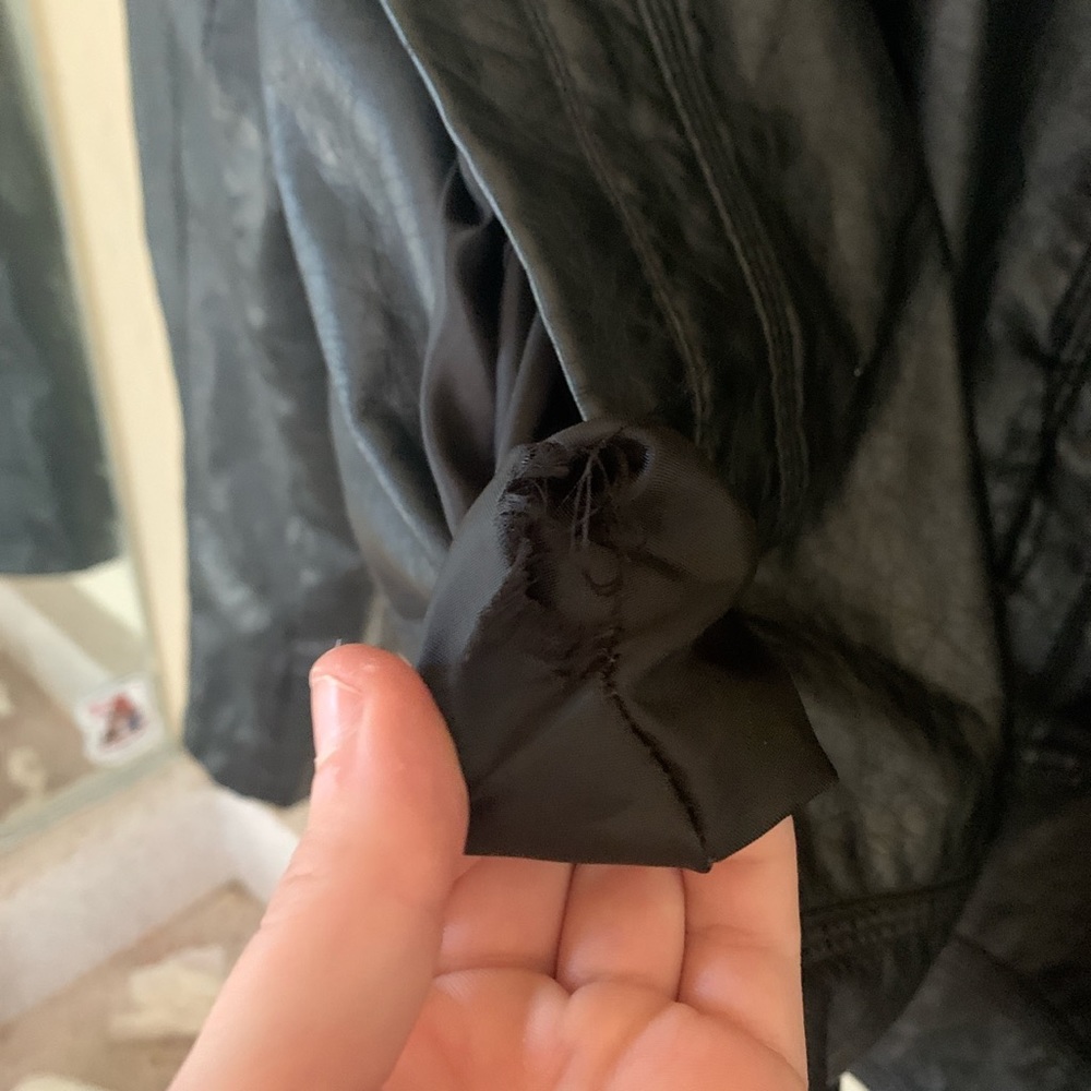 Black leather jacket slightly worn